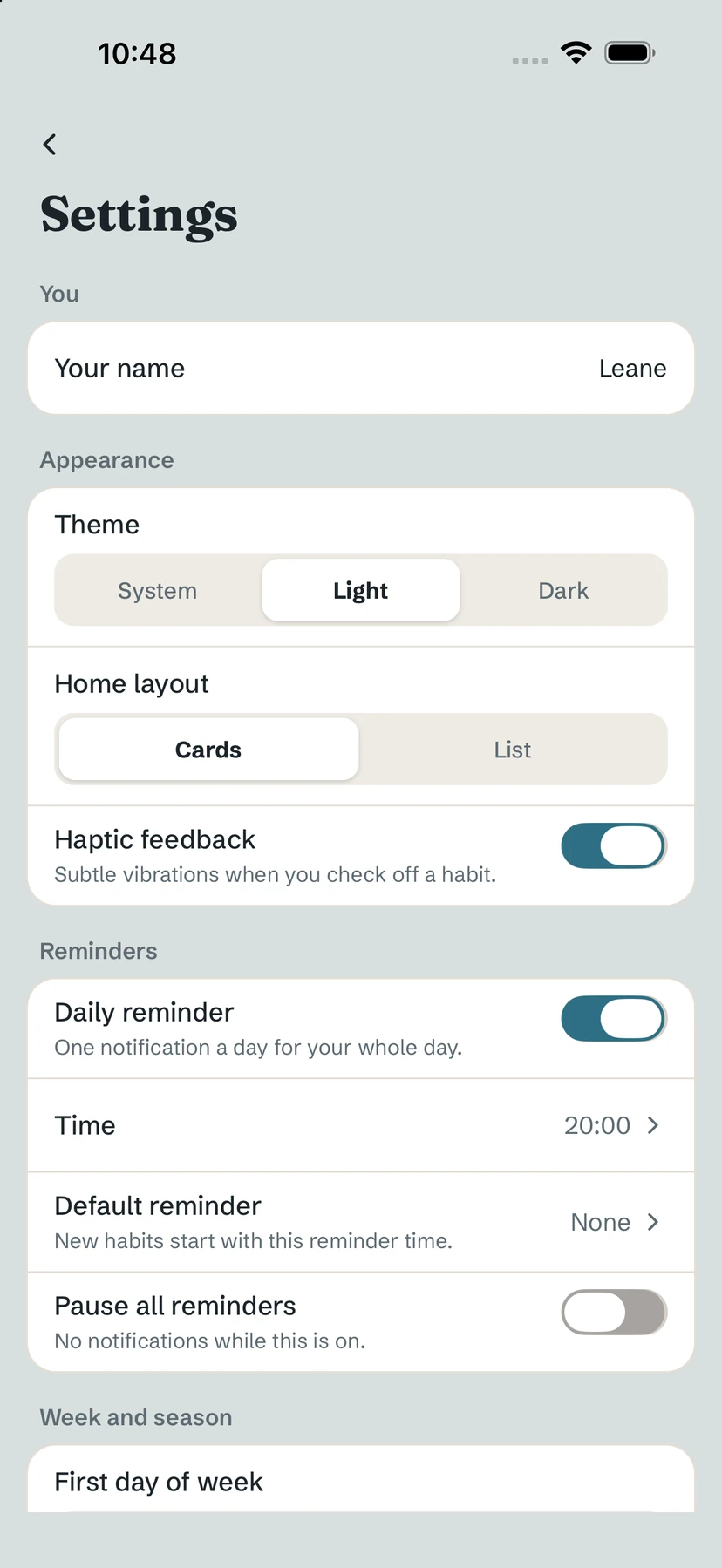 Settings: Your name, Theme, Home layout, Haptic feedback and Reminders