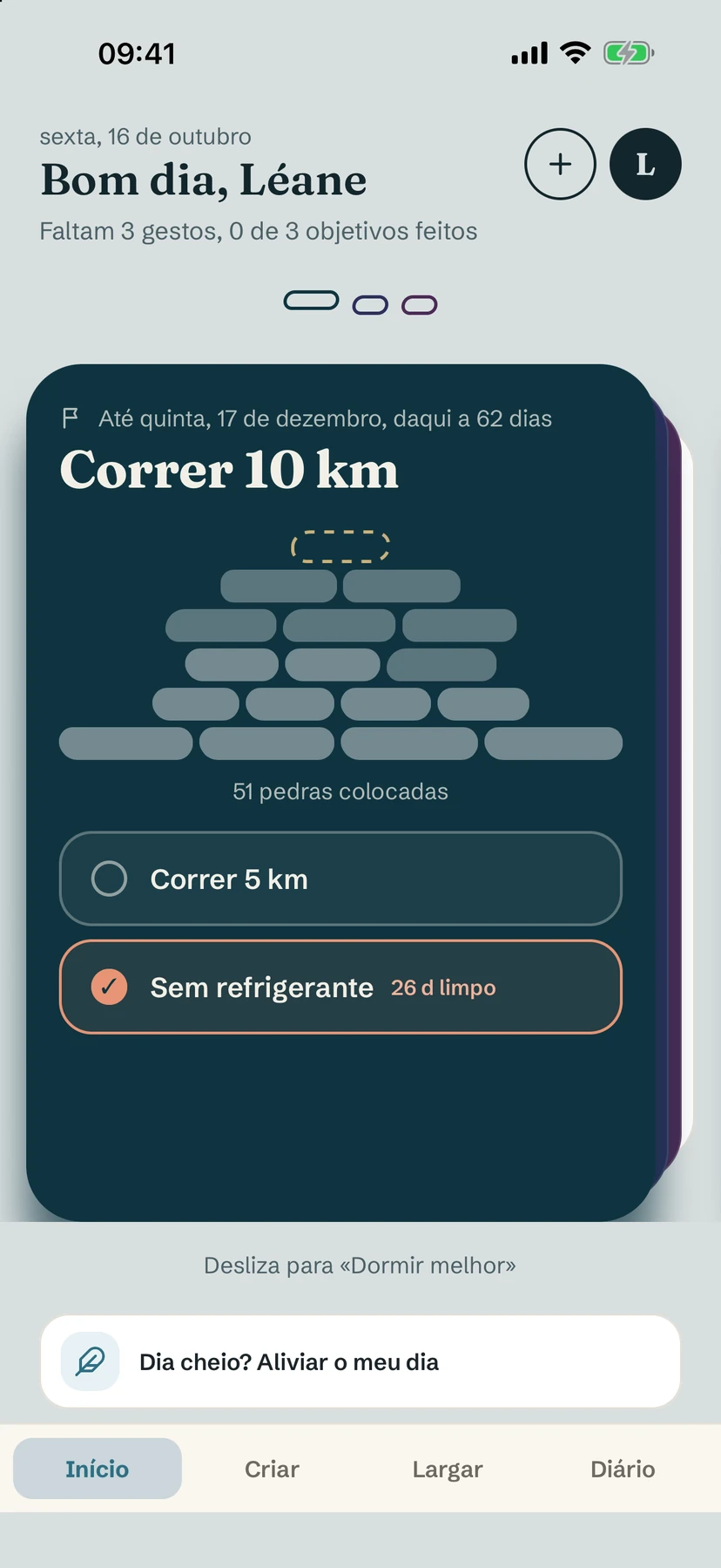Um cartão de objetivo, “Correr 10 km”, com 51 pedras colocadas em um cairn e dois hábitos associados abaixo